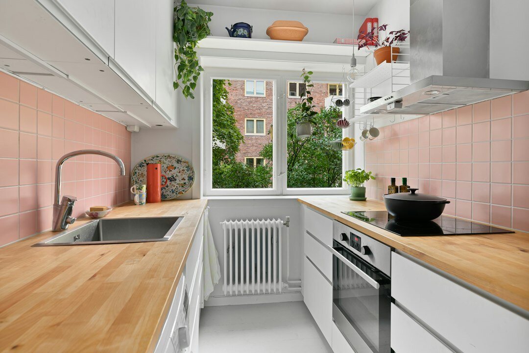 Modern Czech home kitchen with wooden table and natural light