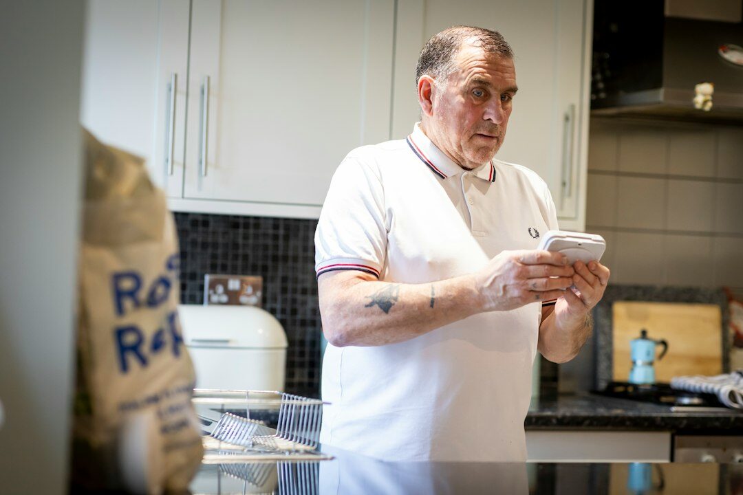 Portrait of an older Czech man home cook smiling in a kitchen
