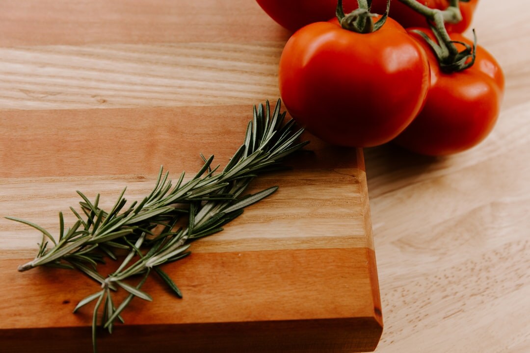 Fresh spring vegetables and herbs on a wooden table